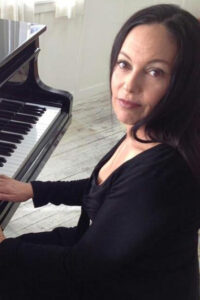 Photo of Jill Cohn at the piano.